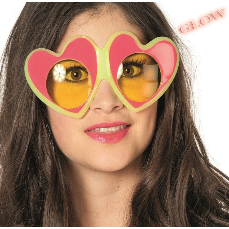 Glowing heart-shaped glasses in the dark pink