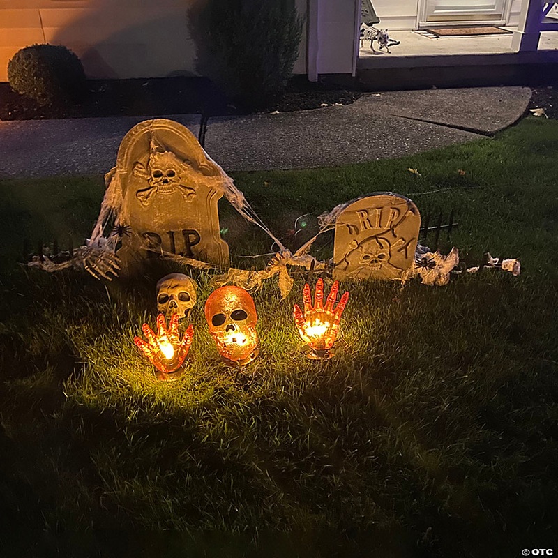 8.5 Lighted Orange Skull and Hands Outdoor Halloween Decoration - 4ft Black Wire
