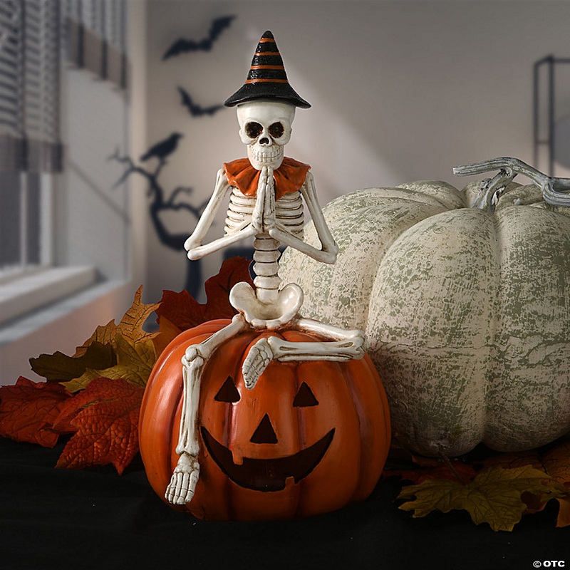National Tree Company 12 in. Skeleton Sitting on Pumpkin
